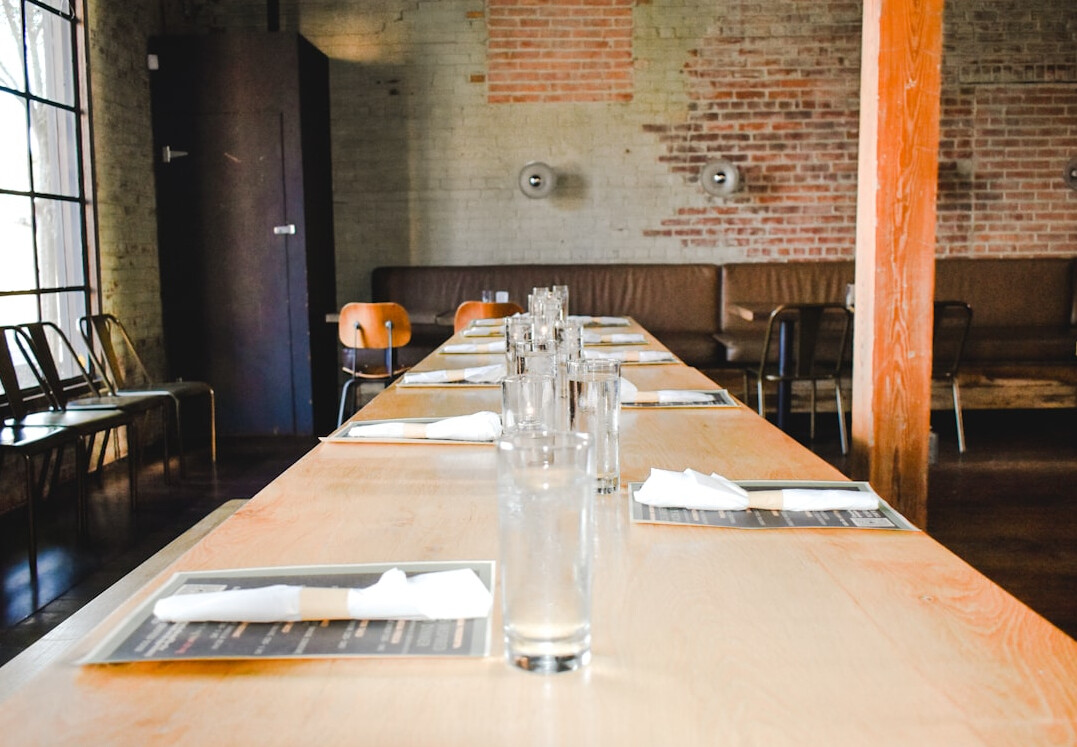Editorial team discussing plans around a table