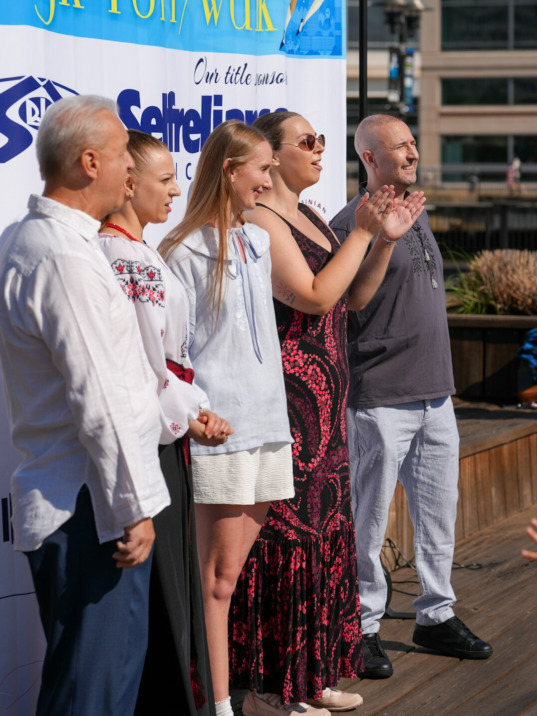 Four Polish editorial team members standing together