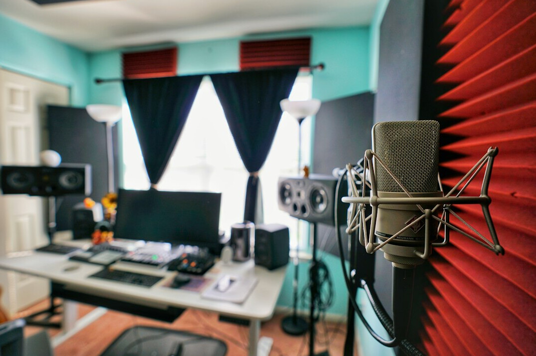 Broadcast studio with screens and desks